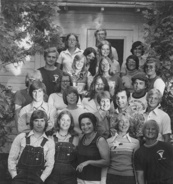 An old photo from the 60's or 70's of YMCA camp counselors on a front stoop