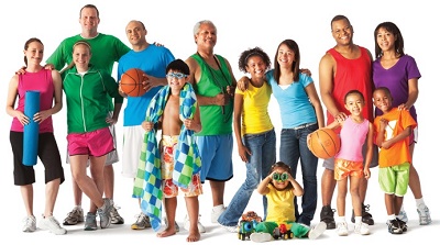 Group of thirteen people, one girl holding yoga mat, a man holding a basketball, a child with a towel, two girls with their arms over each others shoulders, a young child with binoculars. parents and their two children